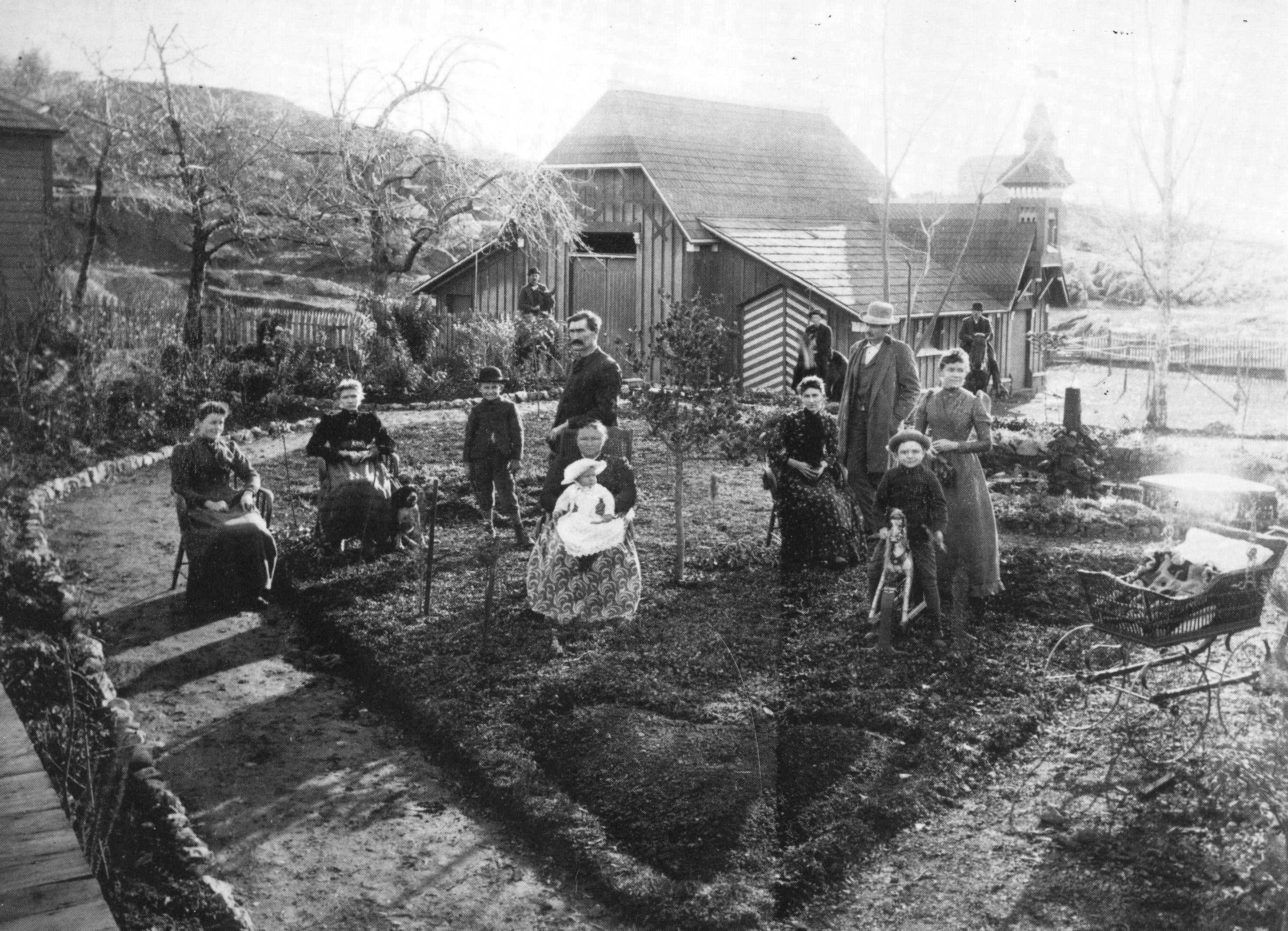 people sitting and standing on front lawn