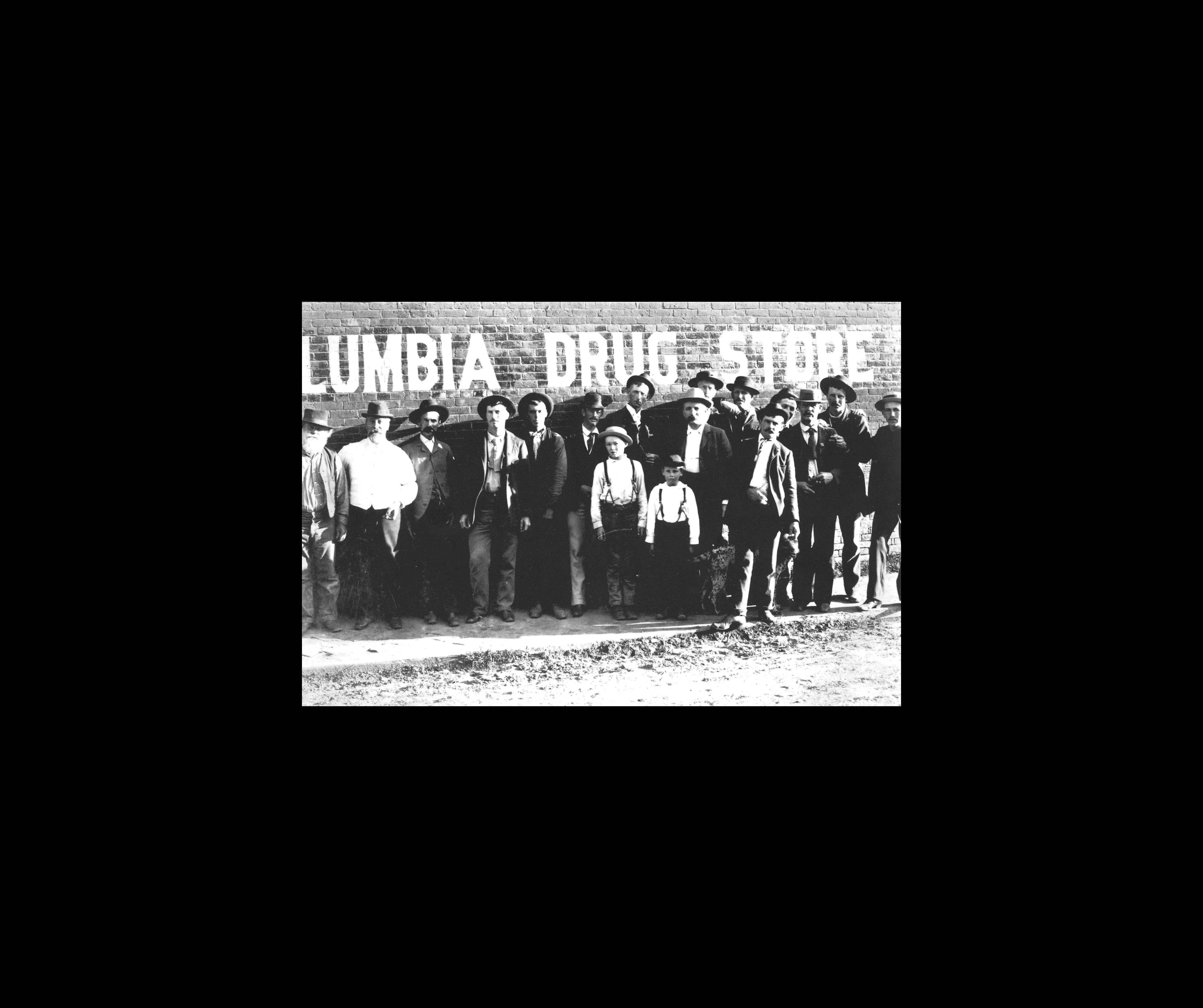 people standing in front of sign