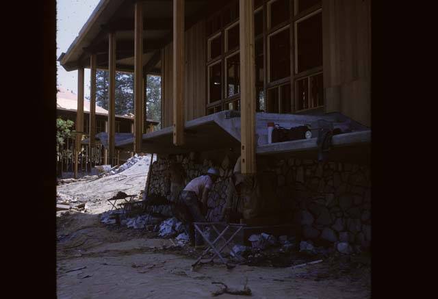 putting rock wall on base of building