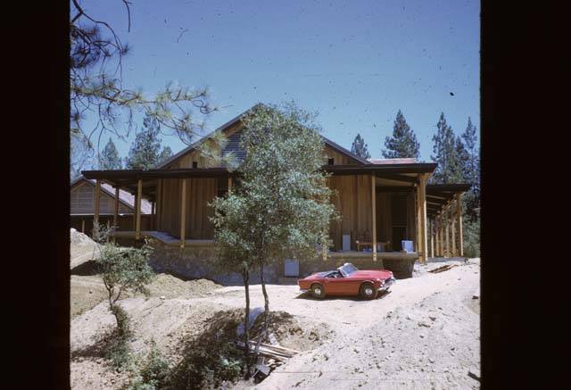 red car in front of Cedar Building