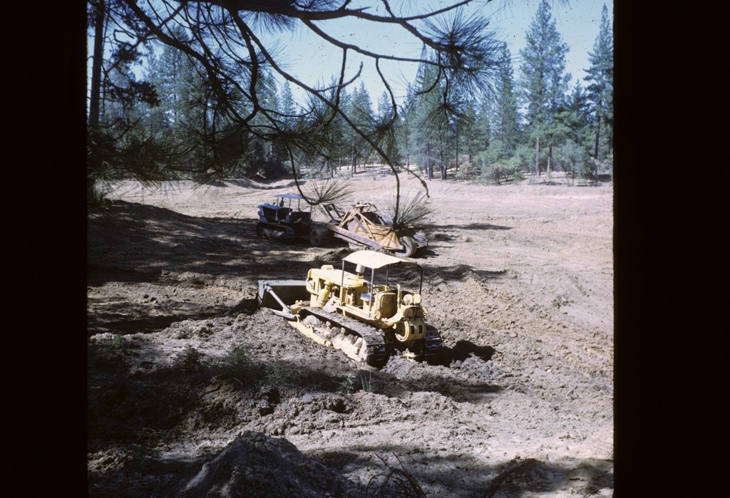 tractor digging out lake 