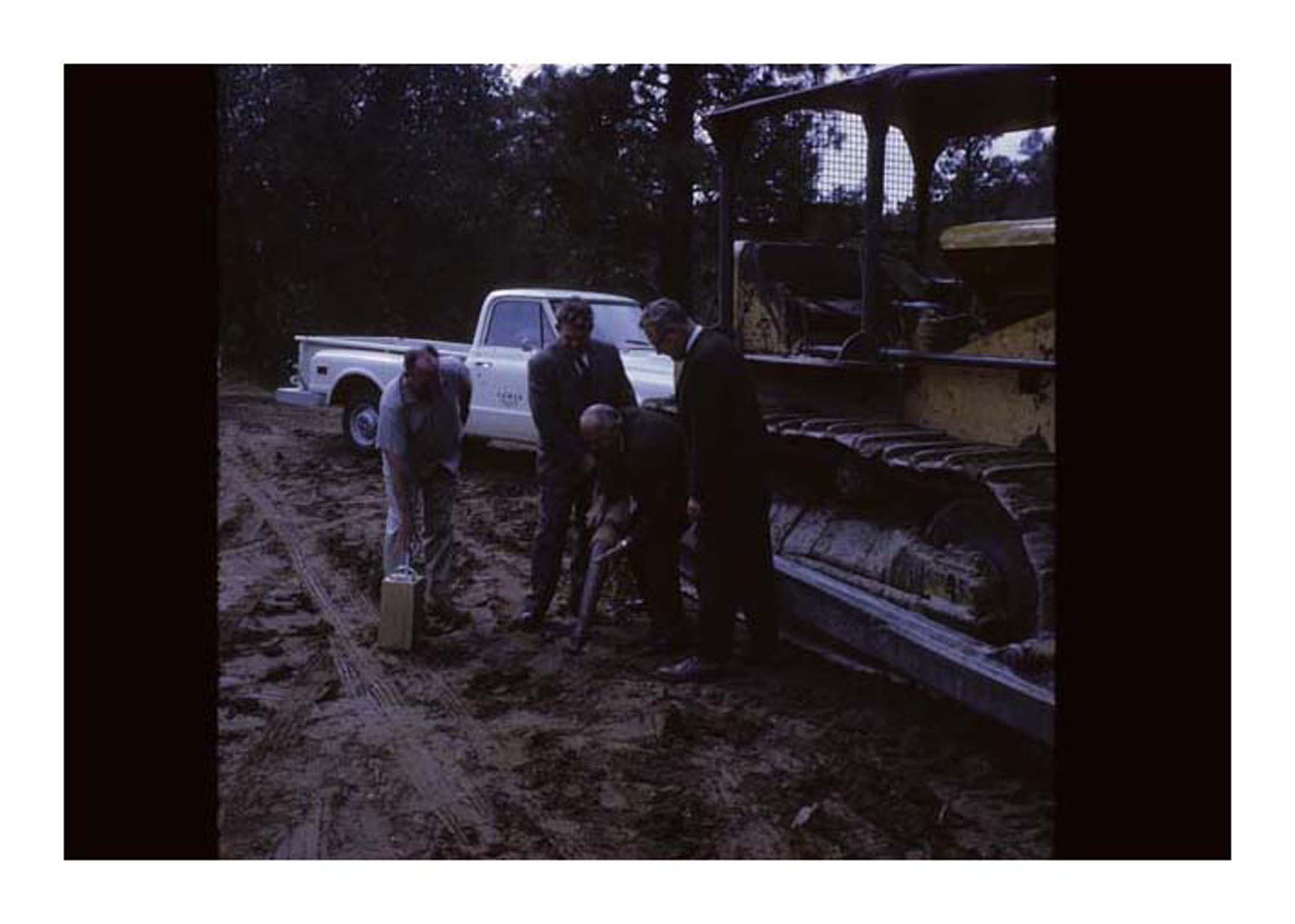people infront of tractor