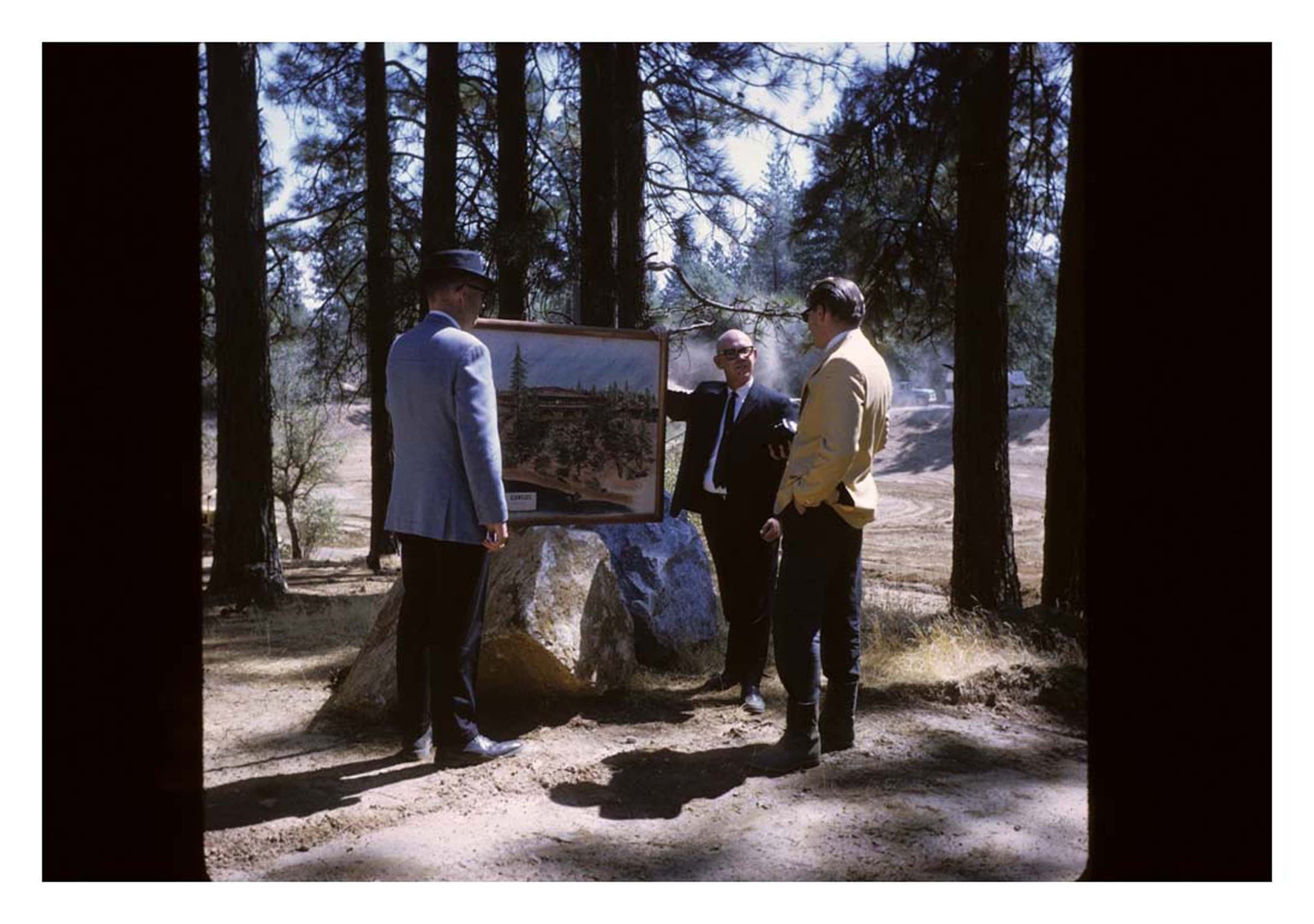 people looking at picture outside