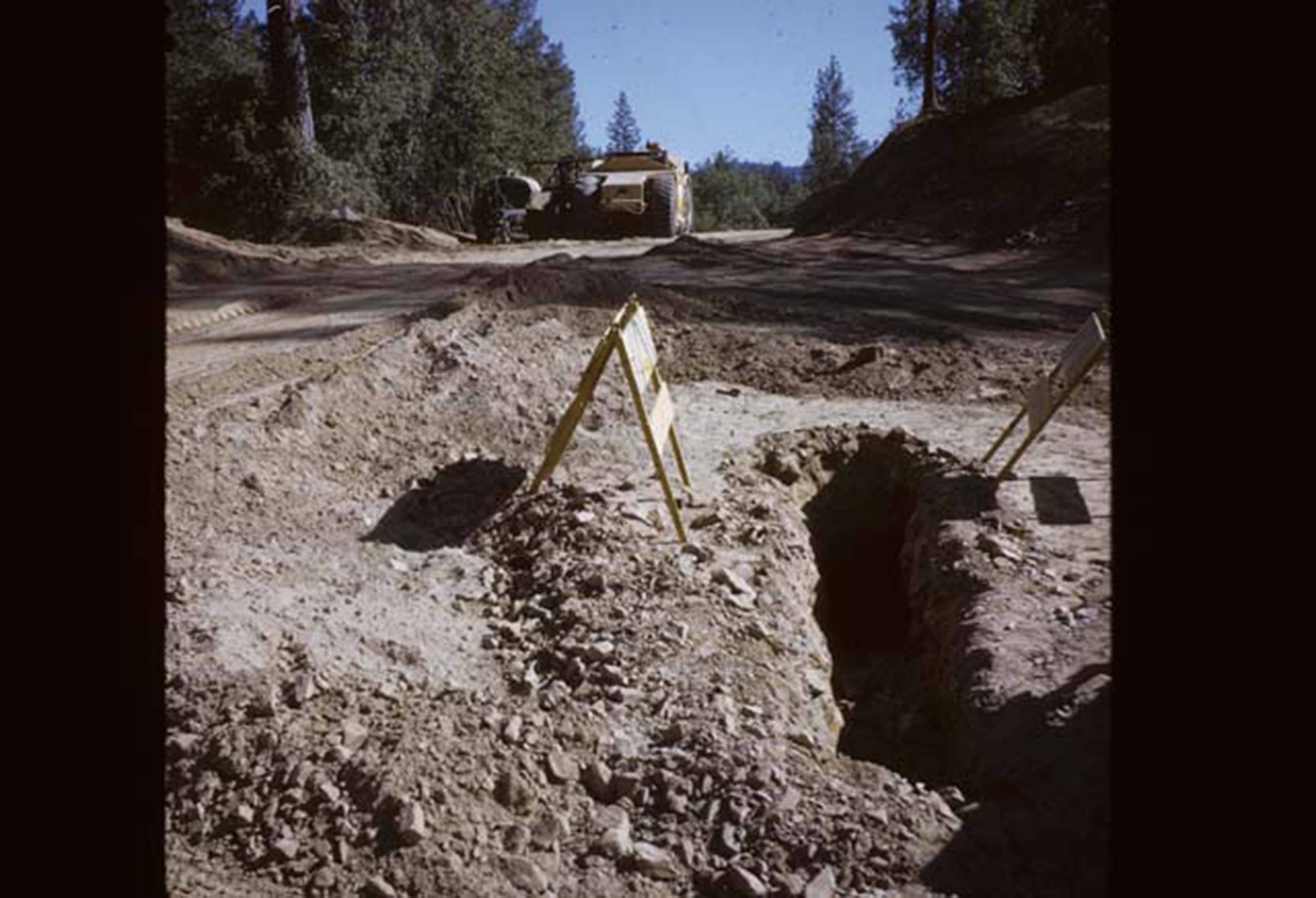 Erosion around campus, looking up at excavator