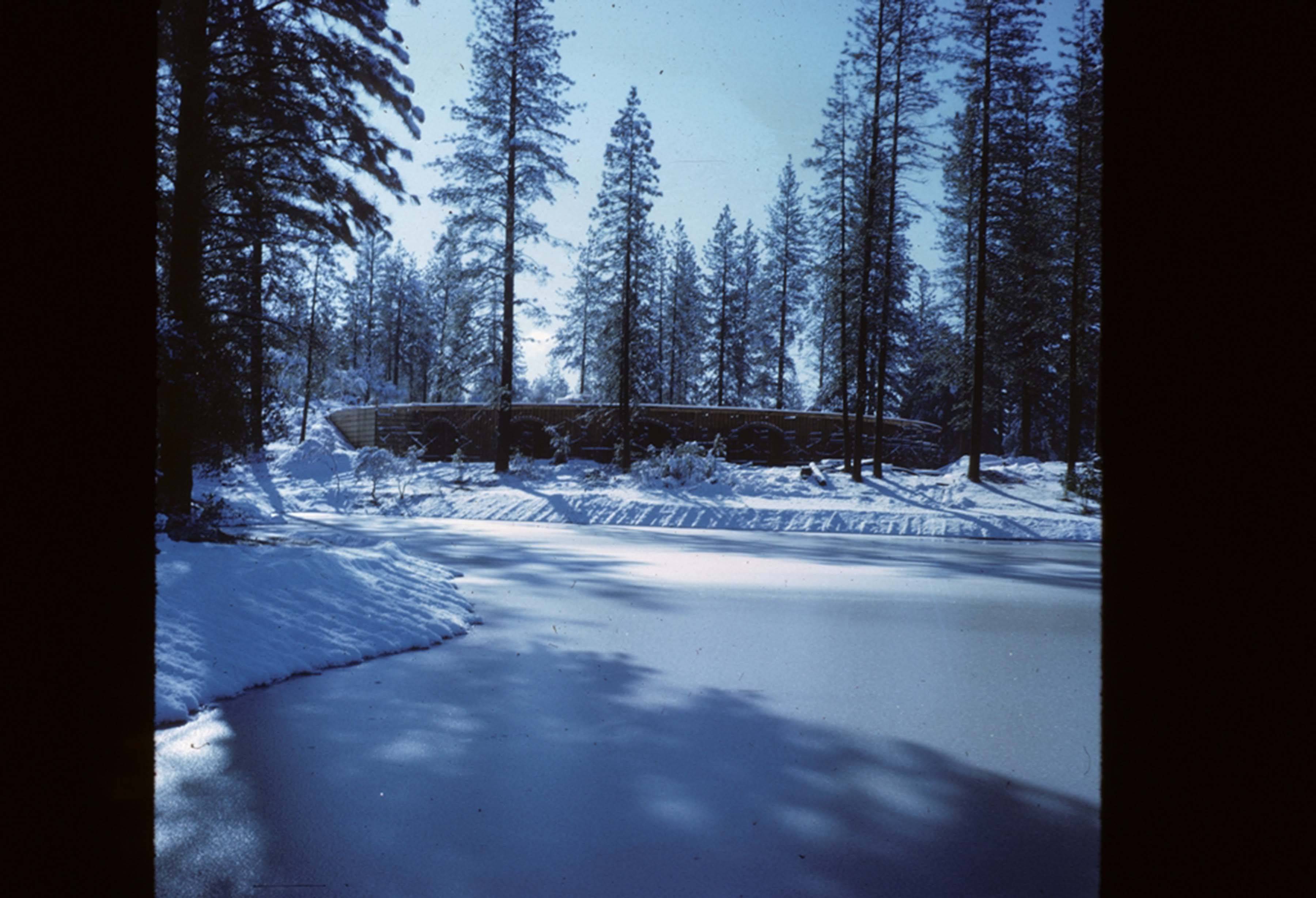 snowy view of manzanita from across the lake