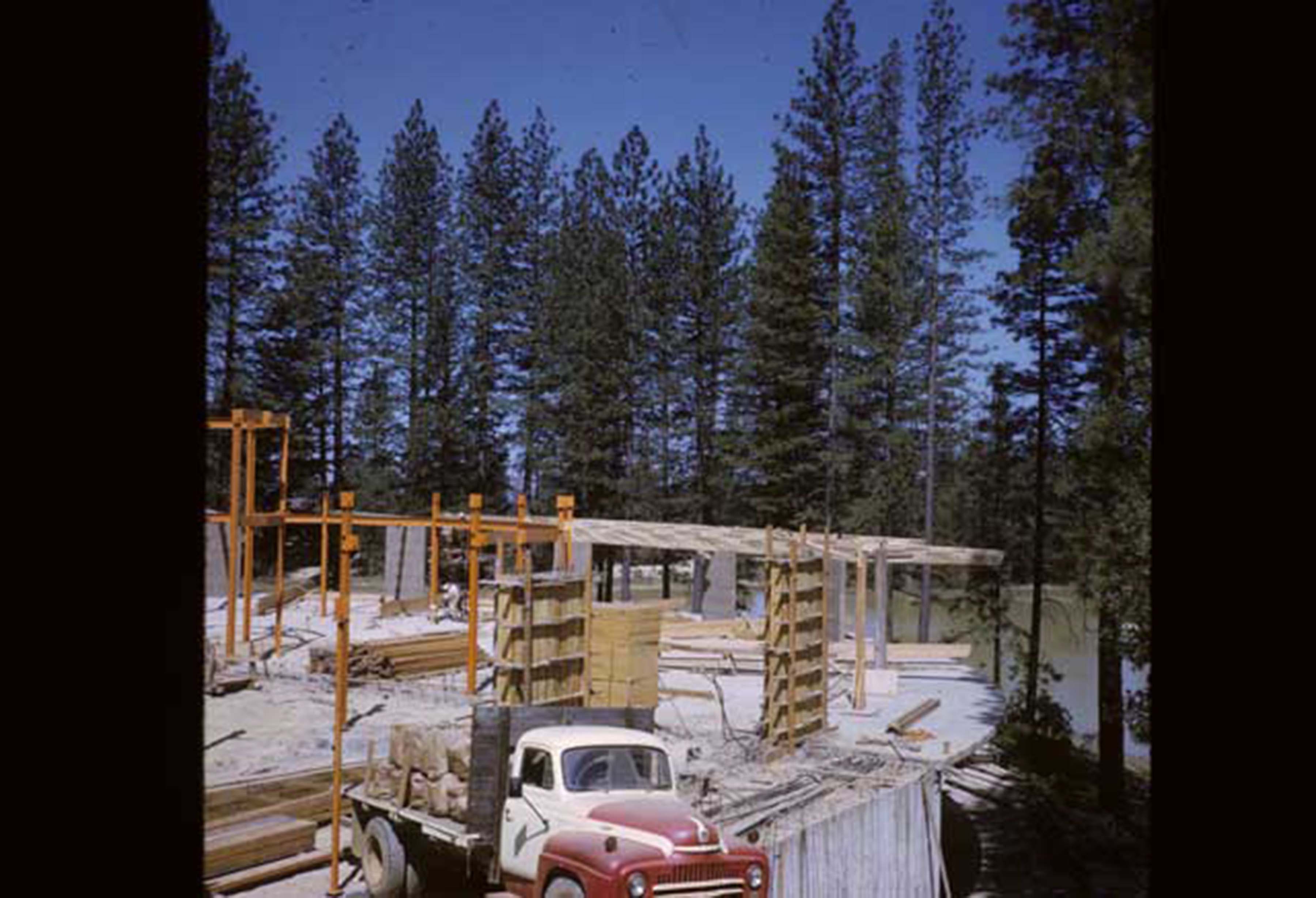 second floor construction with truck in foreground