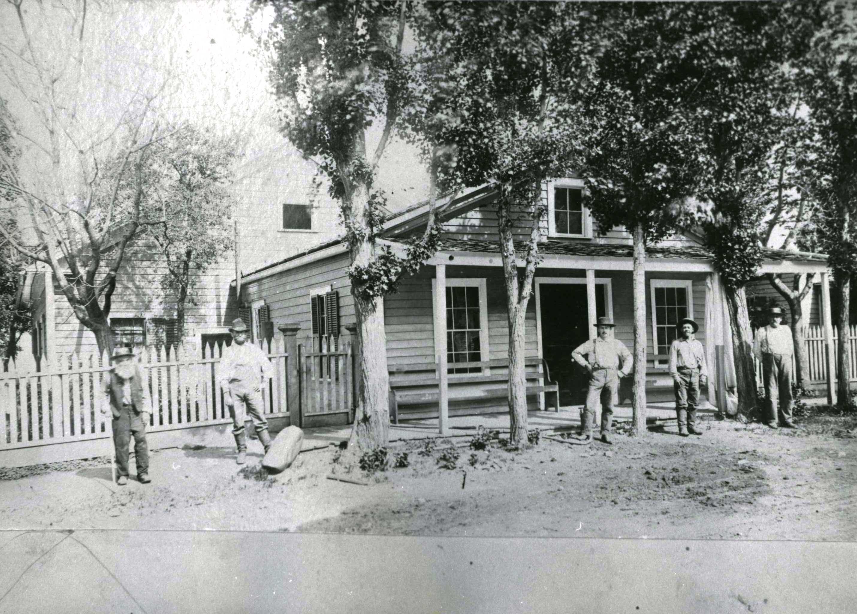 people in front of house