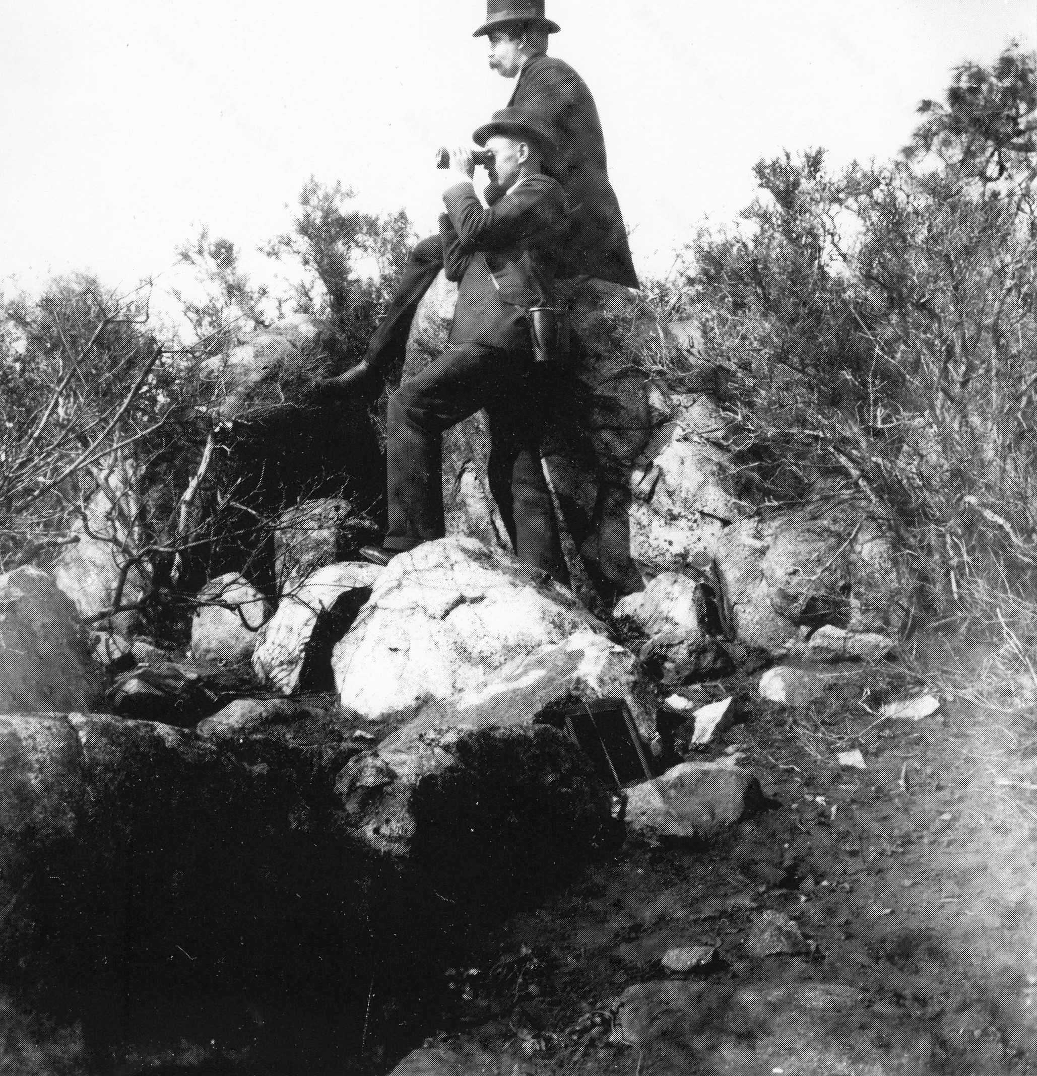 people looking at town from viewpoint