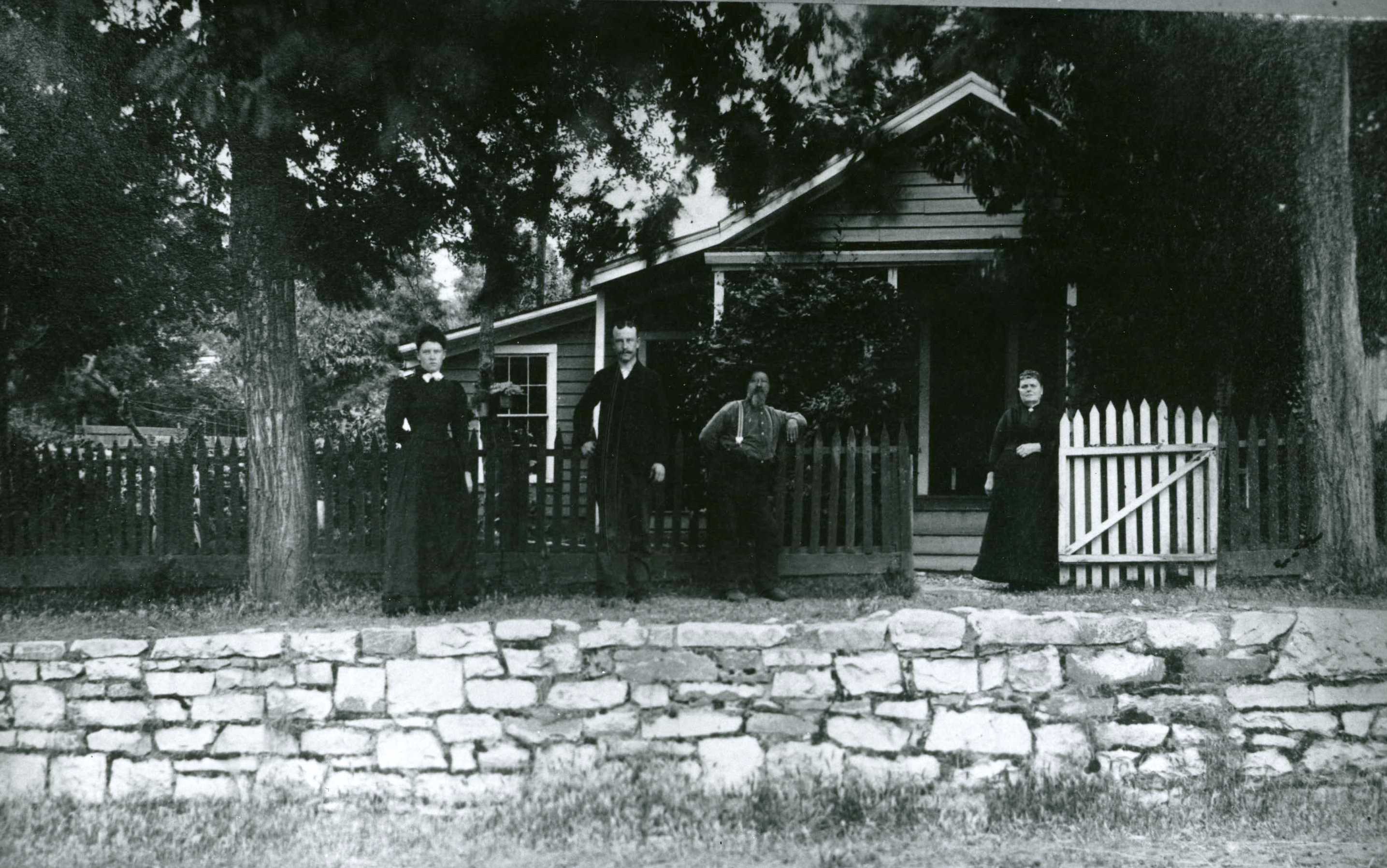 people in front of house