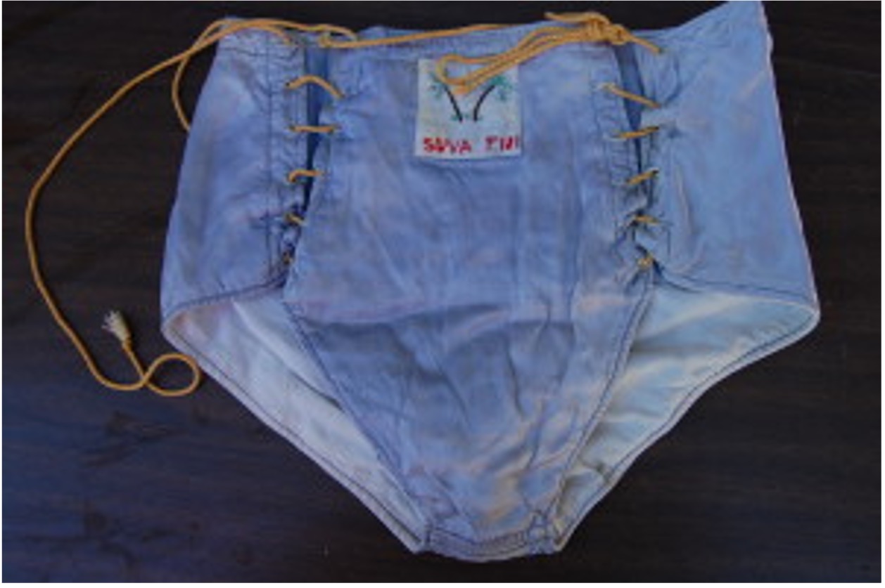 Reds swimsuit made in Suva by a tailor working on the sidewalk. It was completed this in less than one hour with a hand-crank sewing machine.